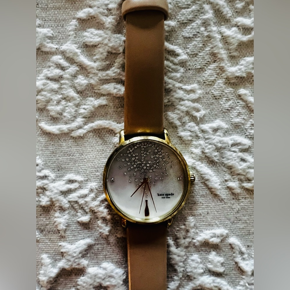 Kate Spade champagne bubbles womens watch. Tan strap.